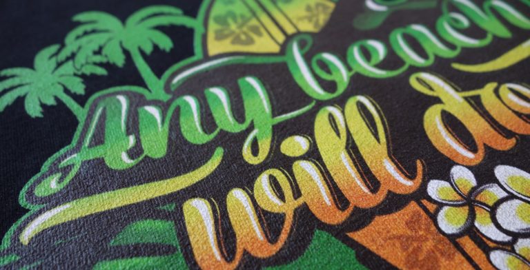 Section of a beach design print on a black t-shirt